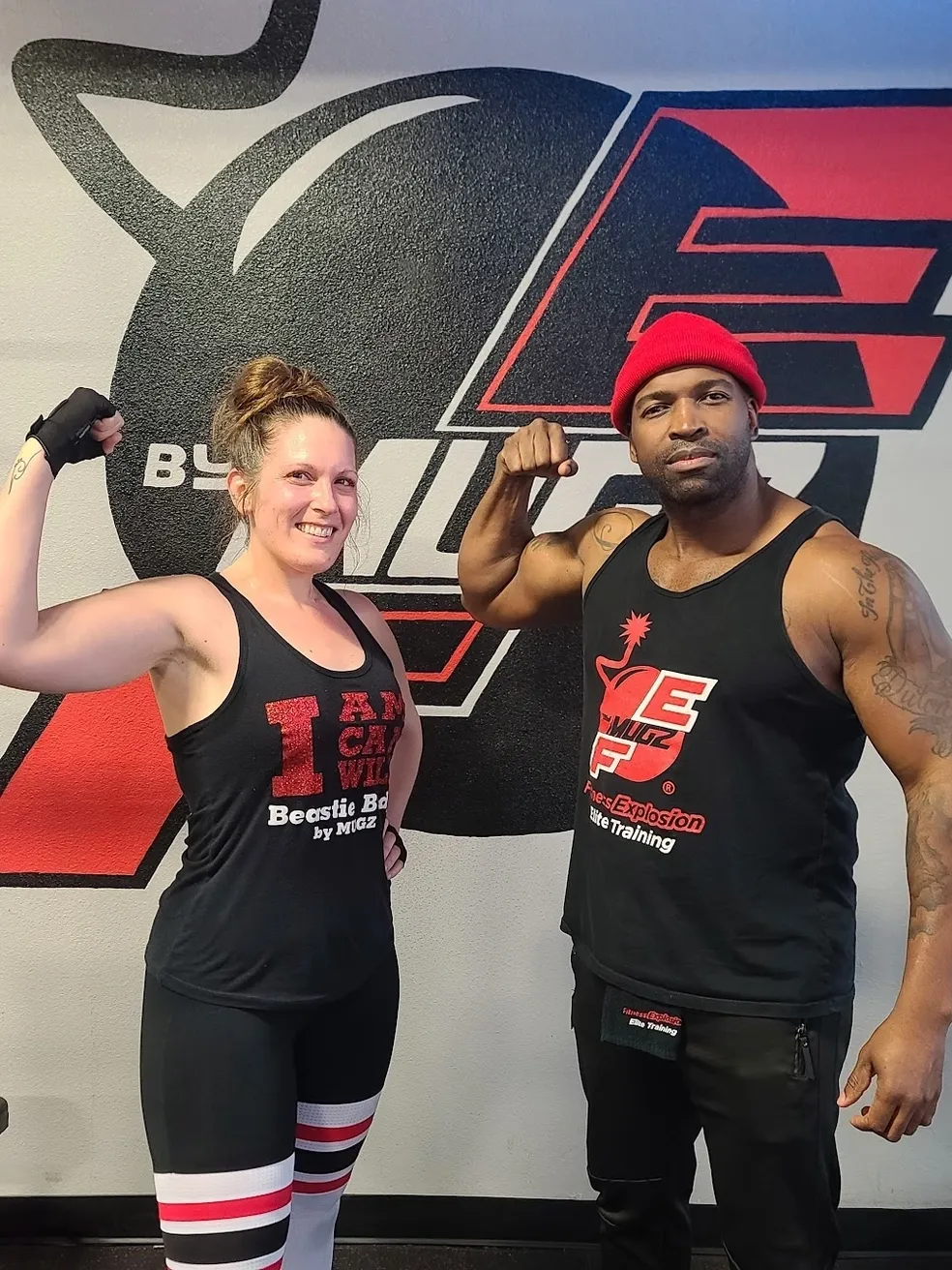 Coach Mugz celebrating a member's milestone achievement