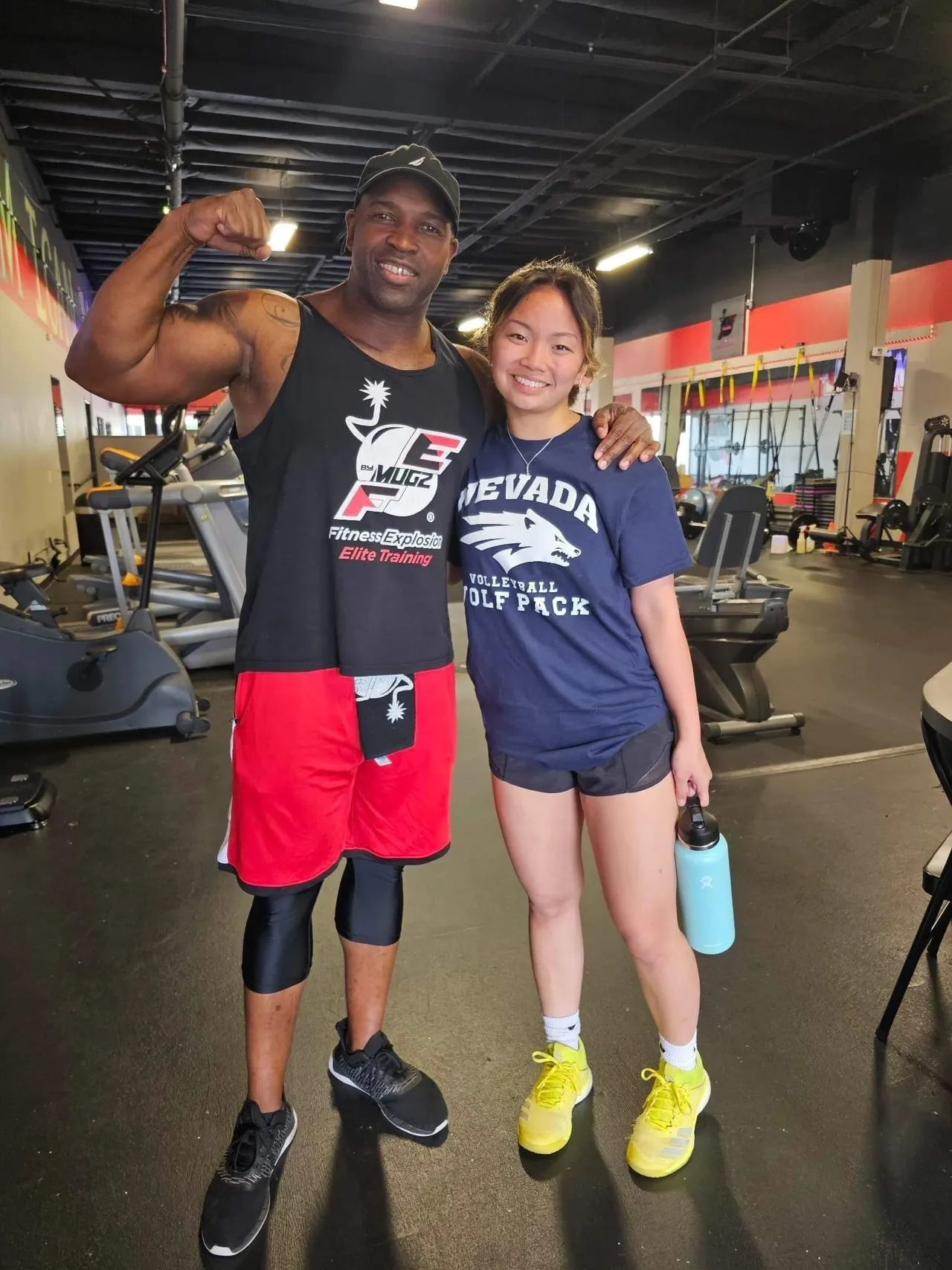 Coach Mugz training a young athlete at Fitness Explosion