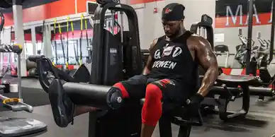 Coach Mugz working one-on-one with a member