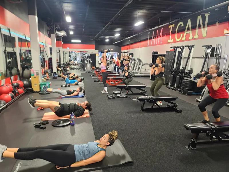 Members on floor doing core work and planks during bootcamp