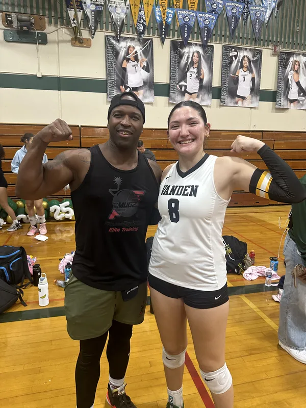 Coach Mugz with FE-trained Vanden volleyball athlete after a game