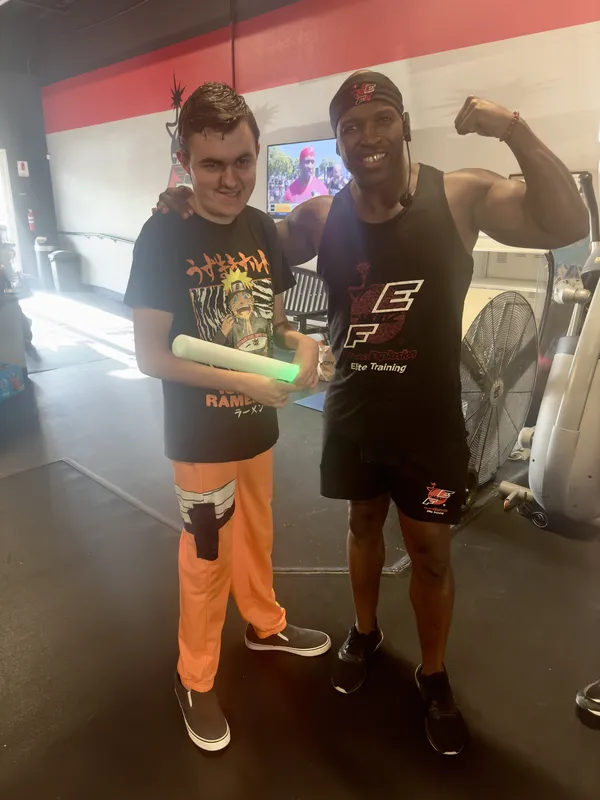 Coach Mugz with adaptive recreation member — inclusive fitness for everyone