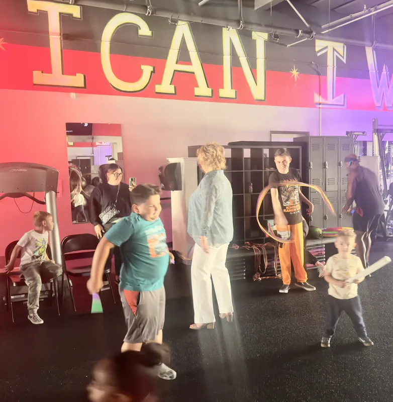 Community family event at Fitness Explosion — kids, parents, hula hoops